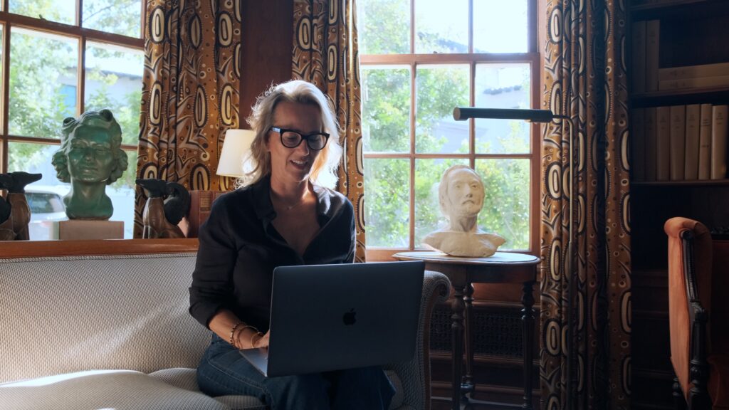 departure lounge travel advisor sitting at laptoptop