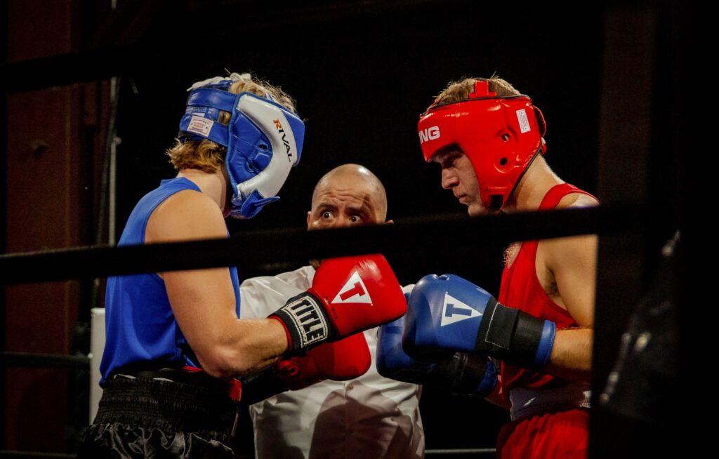 two amateur white collar boxers fighting in white collar fight night