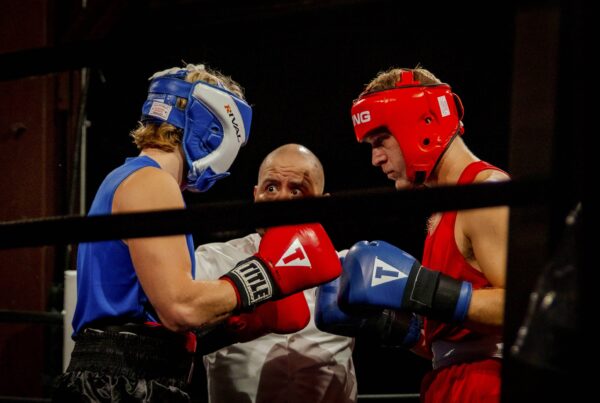 two amateur white collar boxers fighting in white collar fight night